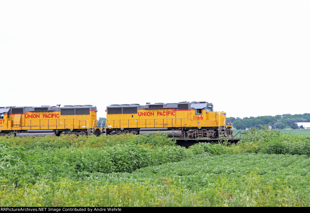Janesville local Geeps front a loaded grain train just departing Landmark
